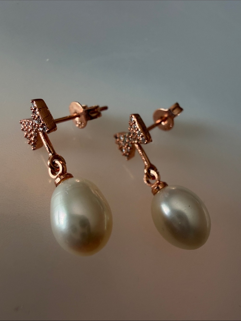 Classic 14K rose gold vermeil teardrop pearls earrings with pave bow